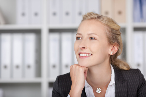 Smiling Businesswoman With Hand On Chin Looking Away - Foto, imagen