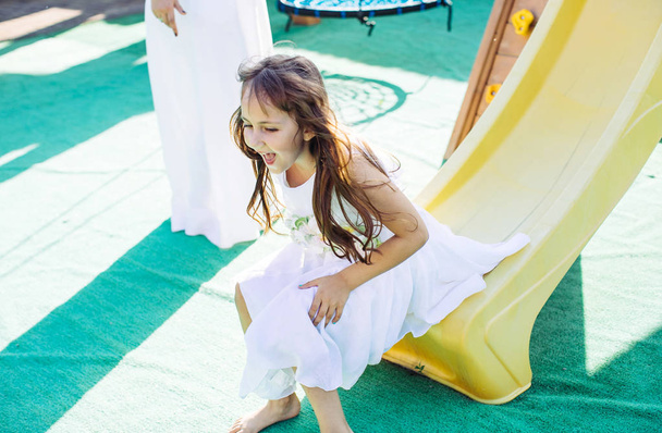Happy little girl at playground - Fotografie, Obrázek