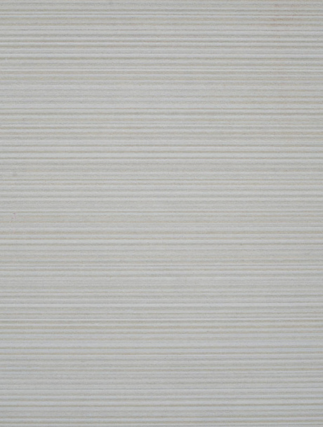 Ecru ceramic tile with horizontal lines on wall - Foto, afbeelding