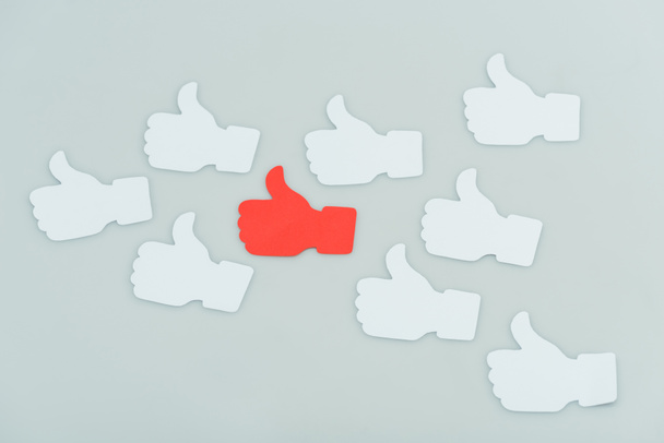 red and white sticky notes with thumbs up shapes isolated on grey - Photo, Image