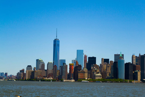 Battery park and the Southern tip of Manhattan from a ferry to Staten Island - 写真・画像