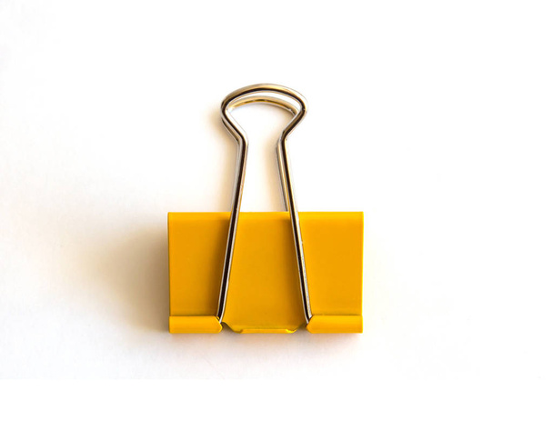 Yellow paper clip isolated on white background - image - Foto, immagini