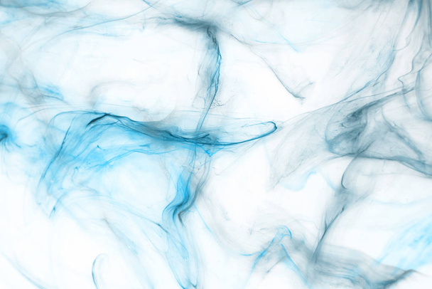 Colorful blue ink  on white paper background. Texture - Фото, изображение