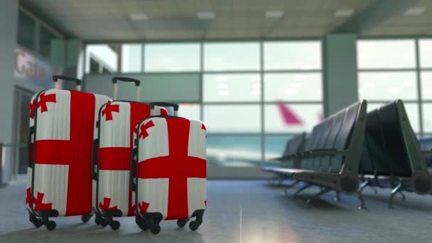 Travel suitcases with flag of Georgia. Georgian tourism conceptual animation - Footage, Video