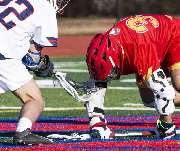 Trapping the ball during lacrosse face off - Photo, Image