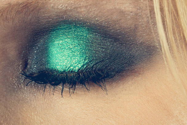 Eye makeup with green shadows - Фото, изображение