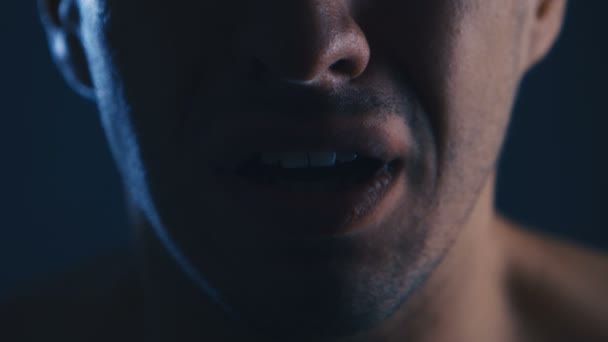Close-up of a frightened man screaming with fear. Horror scene - Footage, Video