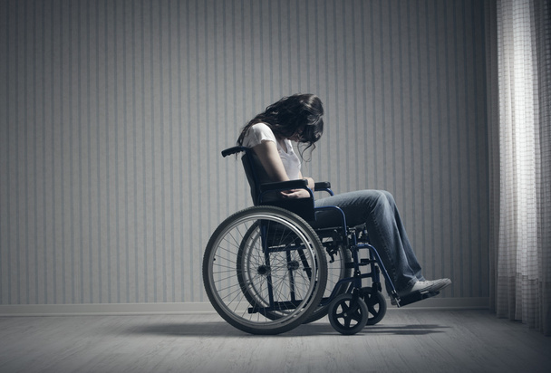 Crying woman sitting in wheelchair - Zdjęcie, obraz