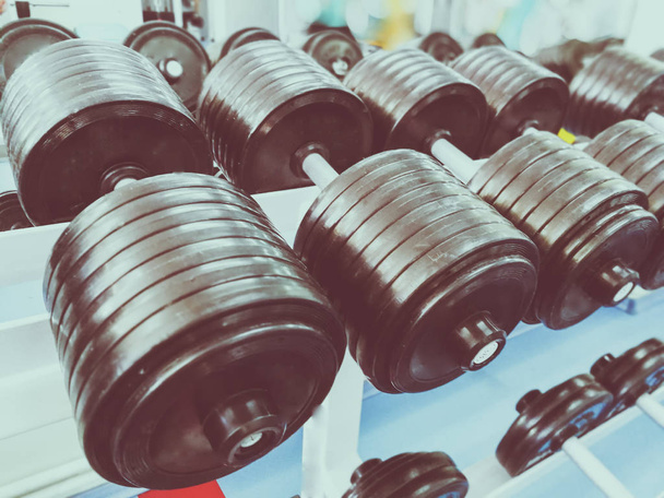 a row of dumbbells in the gym - Photo, Image