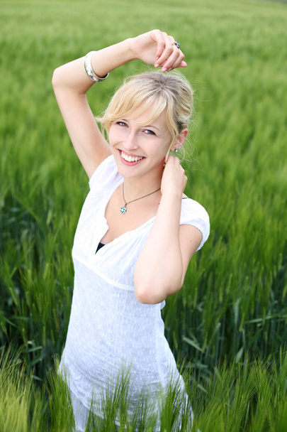 Smiling blond female - Фото, изображение
