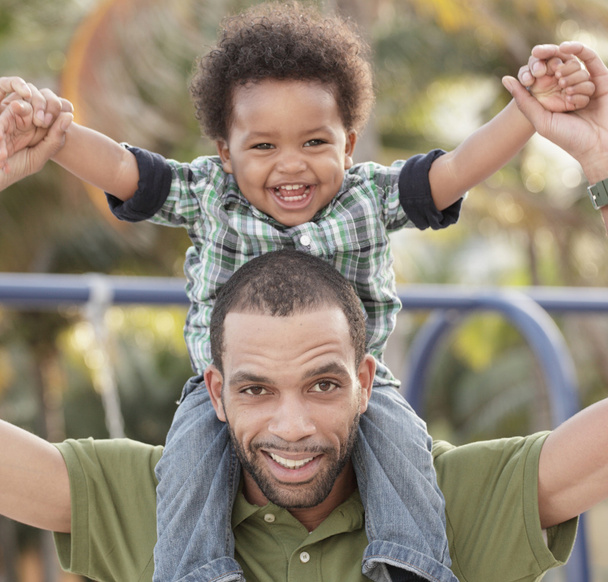 Father and son smiling - 写真・画像