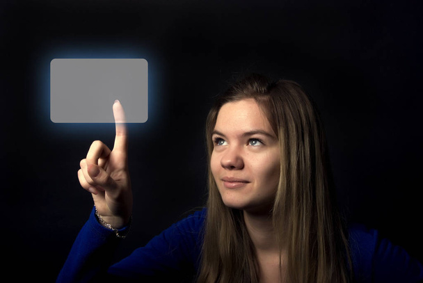 Portrait of a young beautiful girl touching digital screen - Zdjęcie, obraz