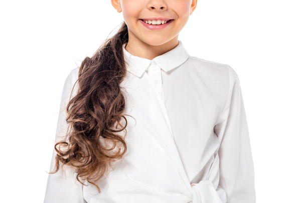 cropped view of schoolgirl in formal wear smiling Isolated On White - Fotoğraf, Görsel