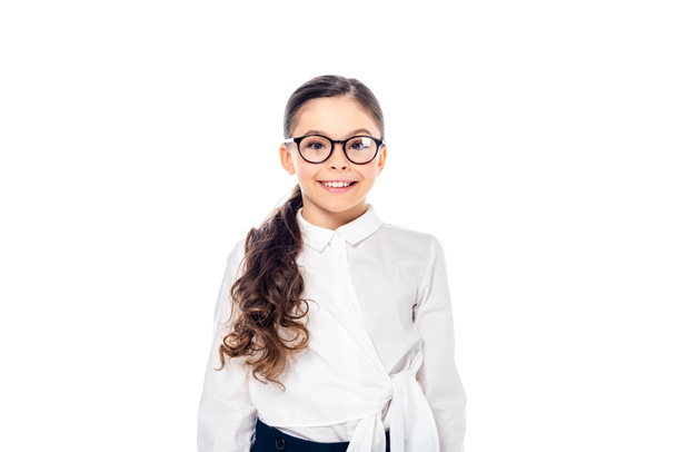 adorable schoolgirl in formal wear and glasses looking at camera and smiling Isolated On White - Photo, Image