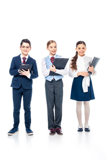 smiling schoolchildren with clipboards pretending to be businesspeople On White - Φωτογραφία, εικόνα