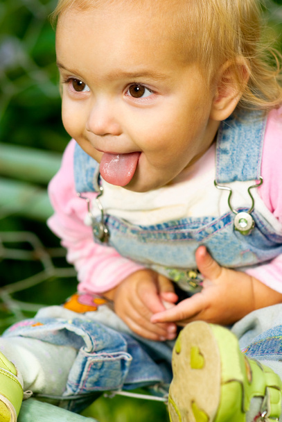 Baby has put out tongue - Photo, Image