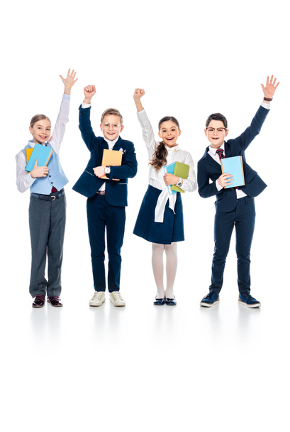 happy schoolchildren with outstretched hands holding books On White - Foto, Imagen