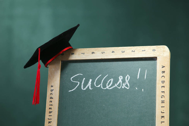 Graduation hat on the blackboard. - Photo, Image