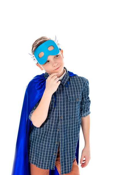 pensive boy in superhero costume touching chin Isolated On White - Photo, Image