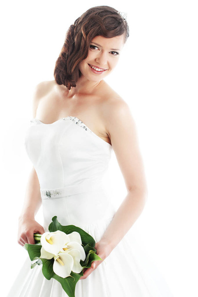Slim beautiful woman wearing luxurious wedding dress over white studio background - Fotografie, Obrázek
