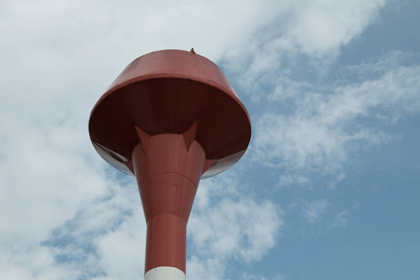 Red and white steel water tank, sky background - Foto, Imagen