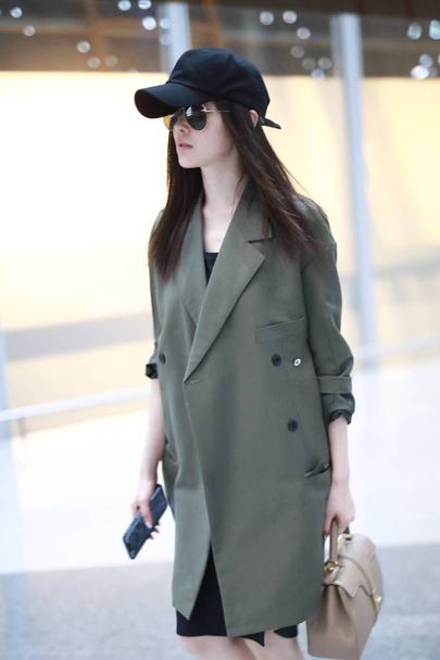 Chinese actress Crystal Zhang or Zhang Tian'ai arrives at the Beijing Capital International Airport before departure in Beijing, China, 16 April 2019. - Zdjęcie, obraz