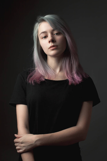 Studio portrait of the beautiful young woman with dyed hair - Foto, Imagen