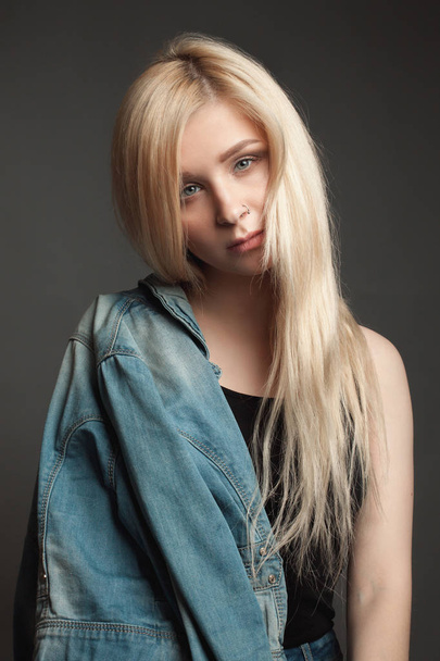 Young woman with beautiful blonde hair. - Фото, изображение