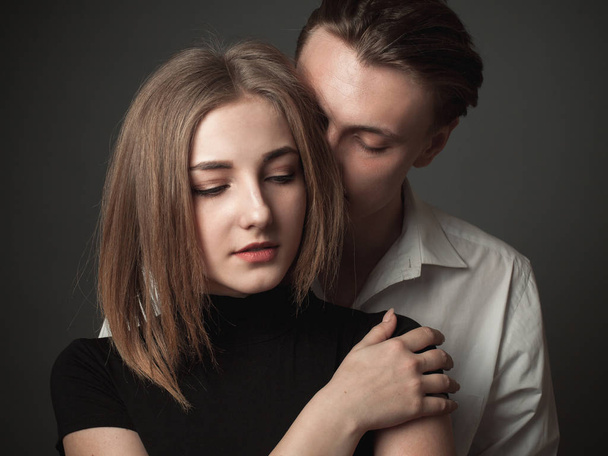 Beautiful young woman and young man in studio. - Fotografie, Obrázek