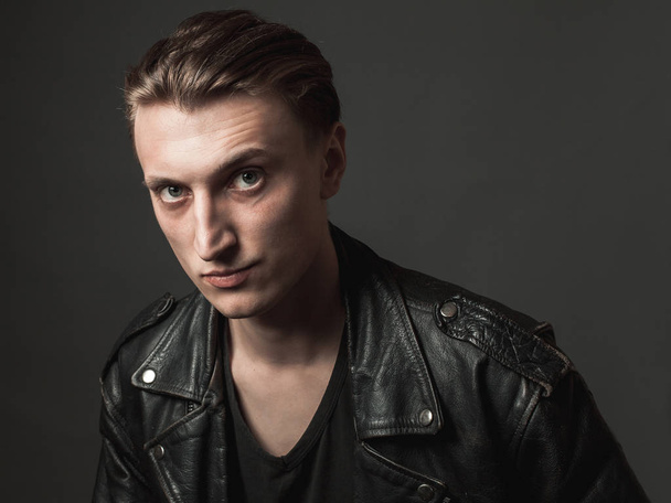 Portrait of the serious young man in leather jacket - Φωτογραφία, εικόνα