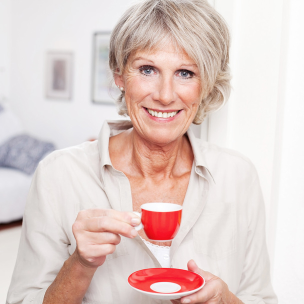 Portrait of a senior lady enjoying espresso - Foto, afbeelding