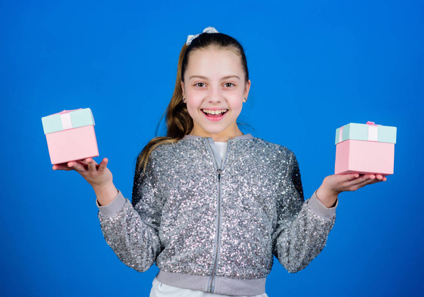 Pick bonus. Special happens every day. Girl with gift boxes blue background. Black friday. Shopping day. Cute child carry gift boxes. Surprise gift box. Birthday wish list. World of happiness - Photo, Image