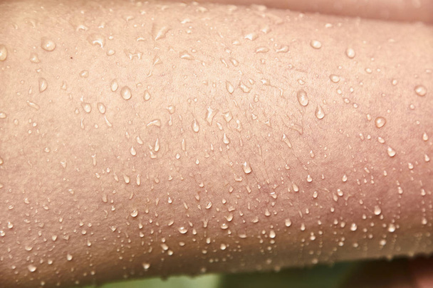 Goosebumps and drops of water on the female skin.  - Photo, Image