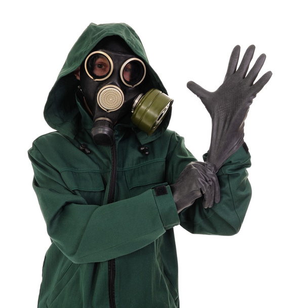 Gas mask, gloves, the person - Φωτογραφία, εικόνα