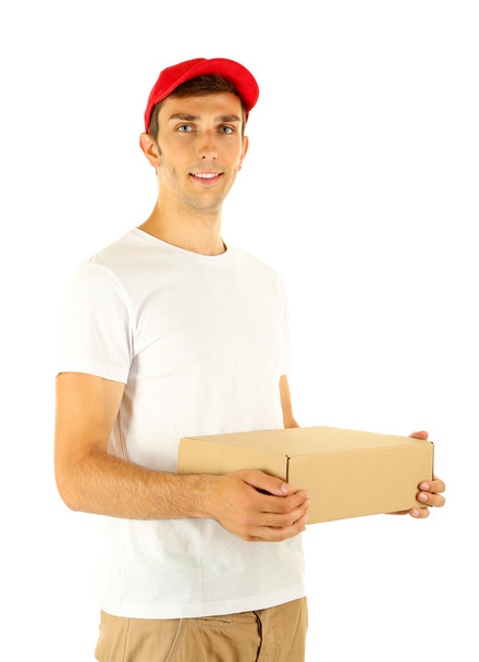 Young delivery man holding parcel, isolated on white - Photo, Image