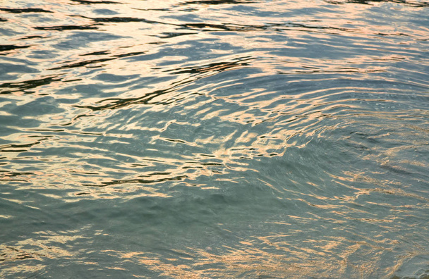 Colorful Sunset reflections on water surface - Fotografie, Obrázek