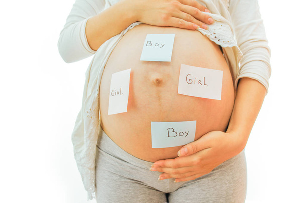 Pregnant girl on white background with stickers - Foto, Bild
