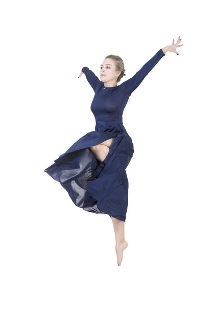 A girl in a blue dress dancing ballet. - Фото, изображение
