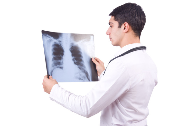 Jeune médecin avec image radiographique sur blanc - Photo, image