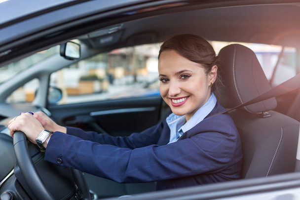 Businesswoman driving a car - Foto, immagini