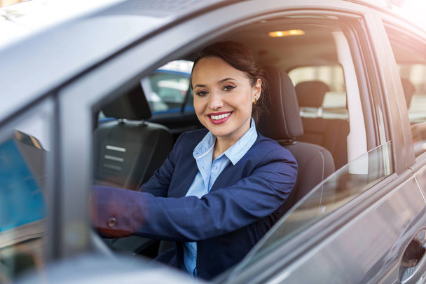 Businesswoman driving a car - 写真・画像