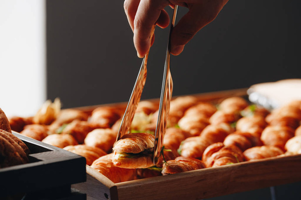 Close Up Fresh Croissants With Salad, Ham And Cheese On Table - 写真・画像
