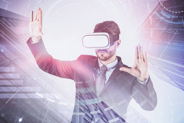 Man in VR headset using business infographic - Zdjęcie, obraz