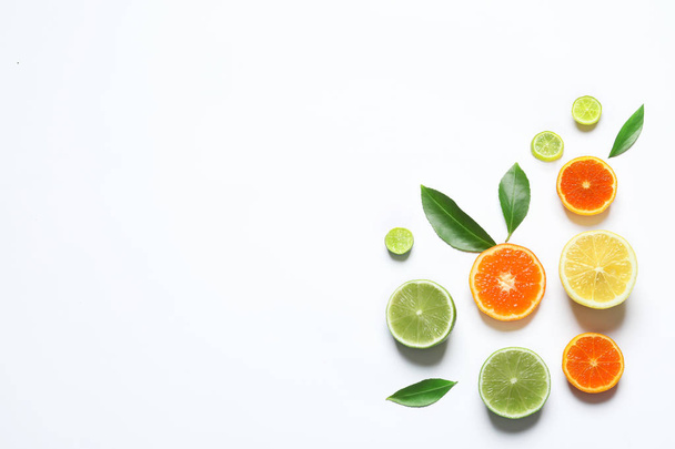 Flat lay composition with different citrus fruits on white background - Fotografie, Obrázek