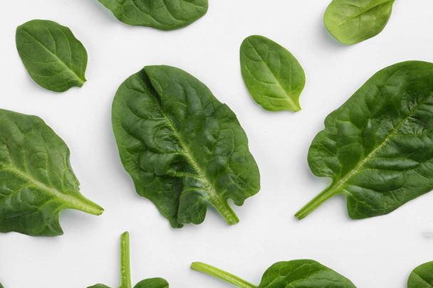 Fresh leaves of spinach isolated on white, top view - Photo, Image