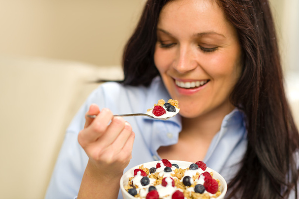 Relaxed woman eating cereal for breakfast - Φωτογραφία, εικόνα