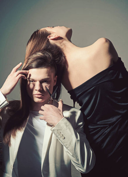 Man and woman. Man cut hair with scissors. Hair style and skincare. Fashion couple in love. Friendship relations. Family bonds. Beauty and fashion. Hairdresser salon and beauty studio - Fotoğraf, Görsel