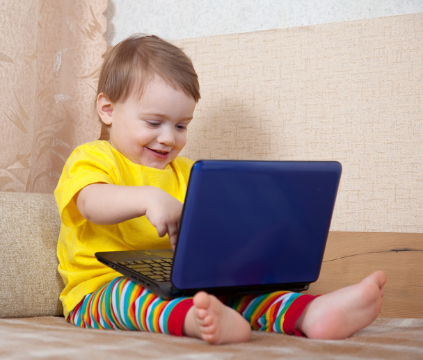 Toddler using laptop in home - Fotó, kép
