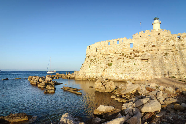 Fort St. Nicholas and lighthouse at the port of Mandraki. - Photo, Image