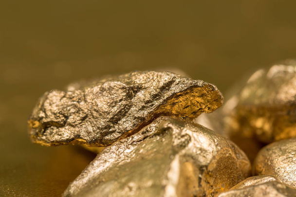 Close up of gold gemstones  - 写真・画像